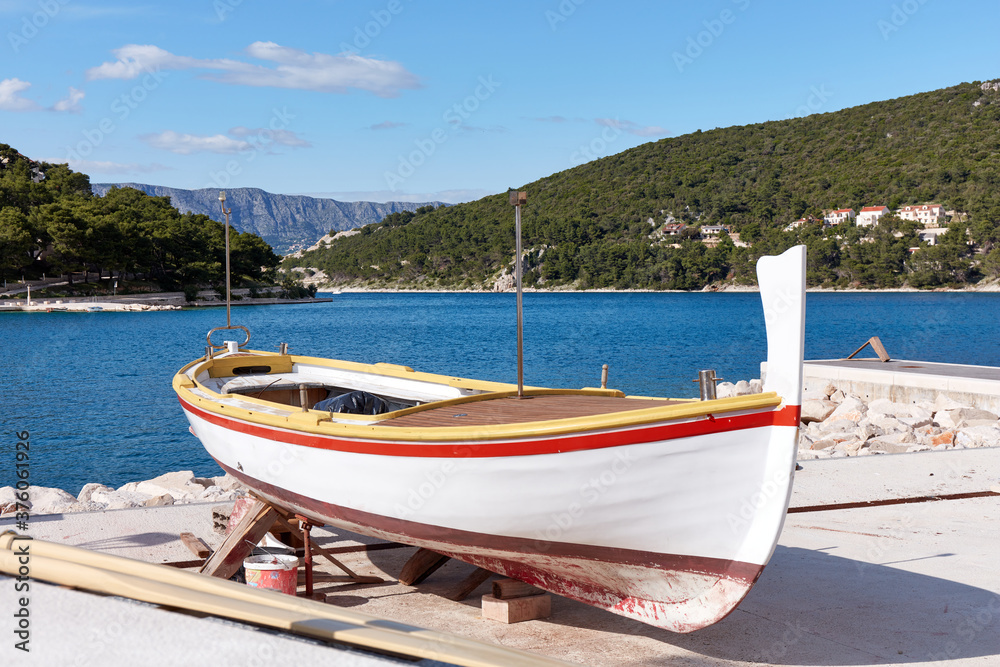 Traditional fishing boat undergoing renovation in the port. Pucisca, Brac Island, Croatia.