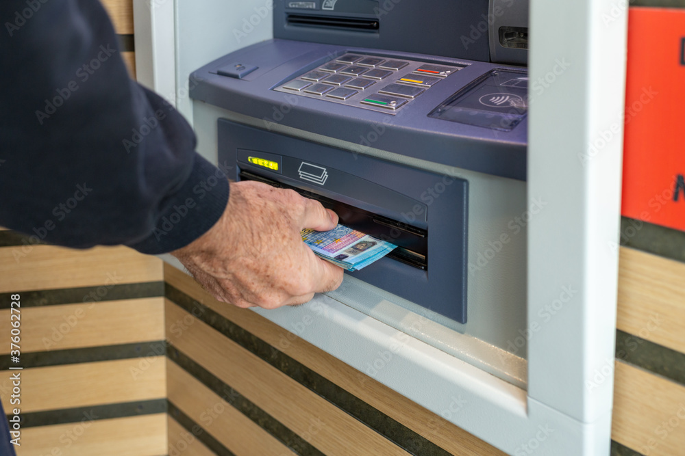 Money at atm, getting money from cash machine Money at atm, getting money from cash machine