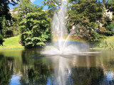 fountains in the park with rainbow