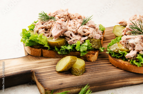Wallpaper Mural Homemade tuna salad sandwiches on cutting board with pickles aside Torontodigital.ca