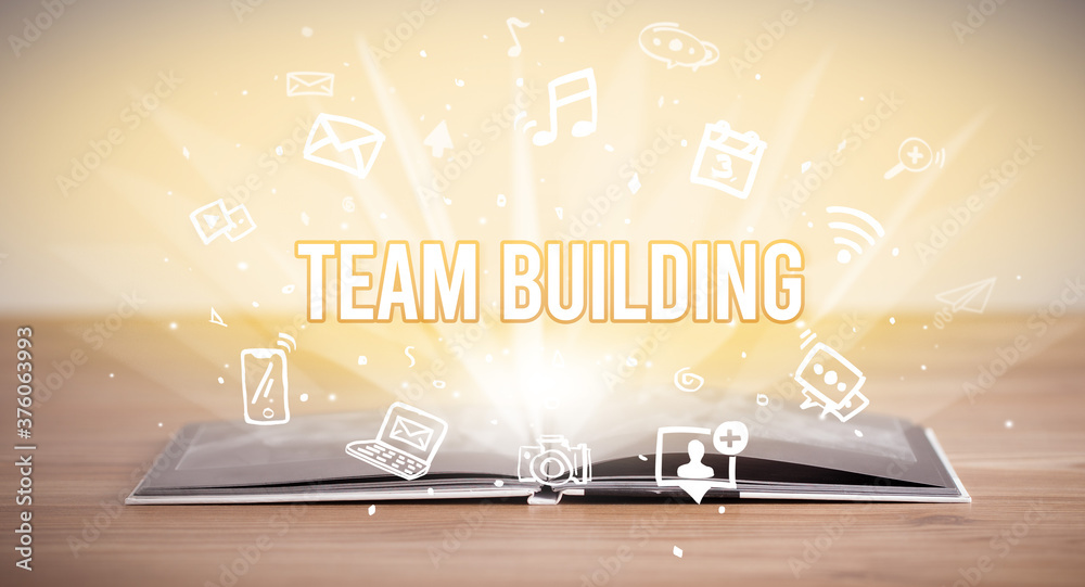 Fototapeta premium Opeen book with TEAM BUILDING inscription, business concept