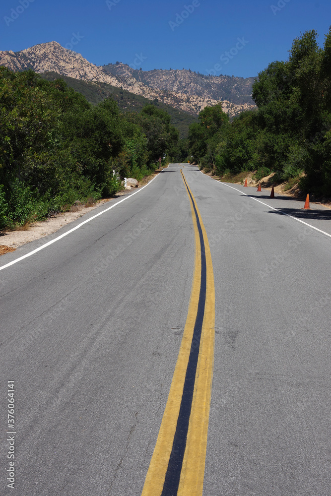 Long empty road leading from Santa Barbara into the Santa Ynez mountains in southern California