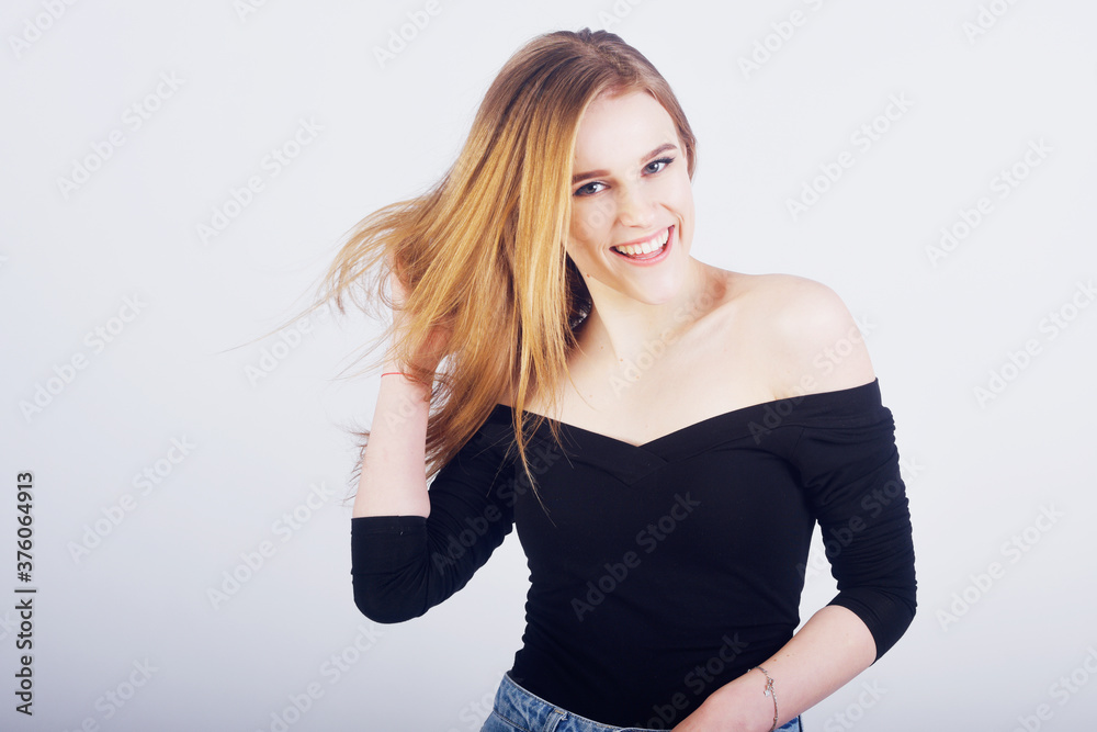 Blonde girl with beautiful hair. Hair care, girl dancing, smiling. Blonde girl with beautiful hair. Hair care, girl dancing, smiling.