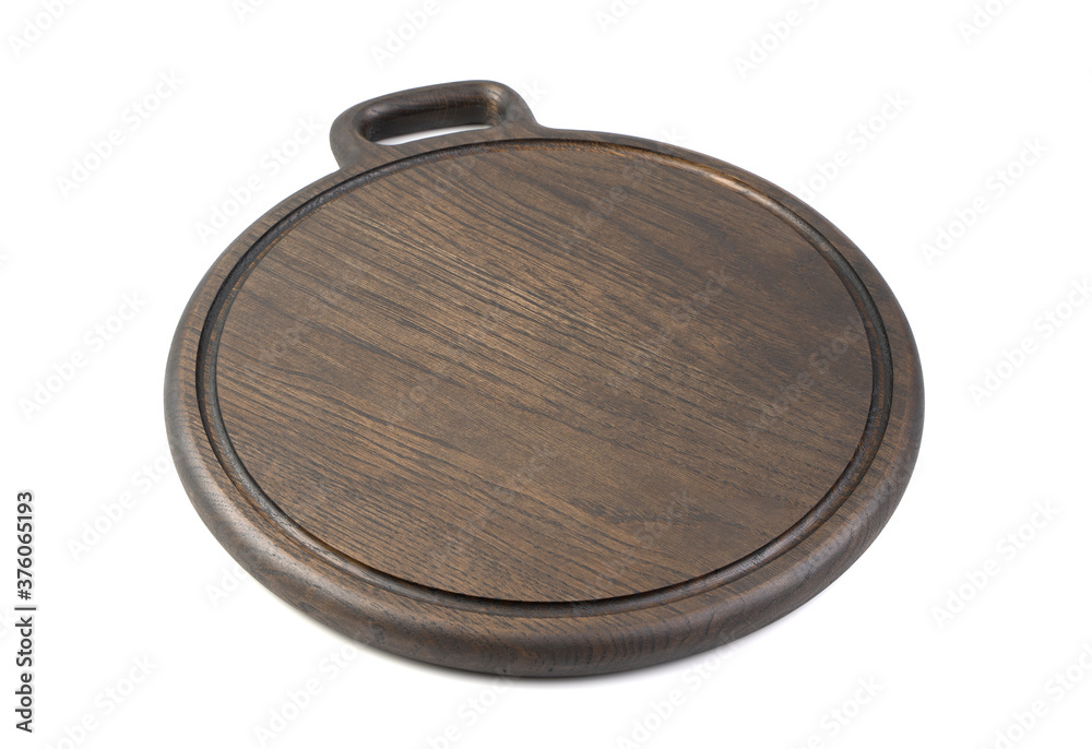 Wooden round cutting Board made of oak material, painted in a dark color, isolated on a white background. Object to use in the design. The concept of cooking. Wooden round cutting Board made of oak material, painted in a dark color, isolated on a white background. Object to use in the design. The concept of cooking.