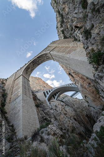 The spectacular stone bridge spanning over a very high narrow gorge