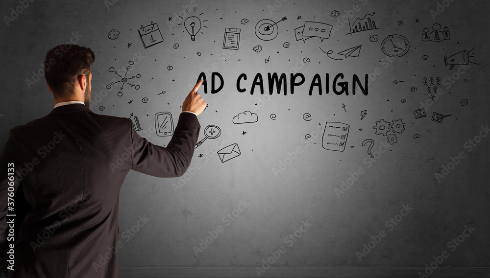 businessman drawing a creative idea sketch with AD CAMPAIGN inscription, business strategy concept businessman drawing a creative idea sketch with AD CAMPAIGN inscription, business strategy concept