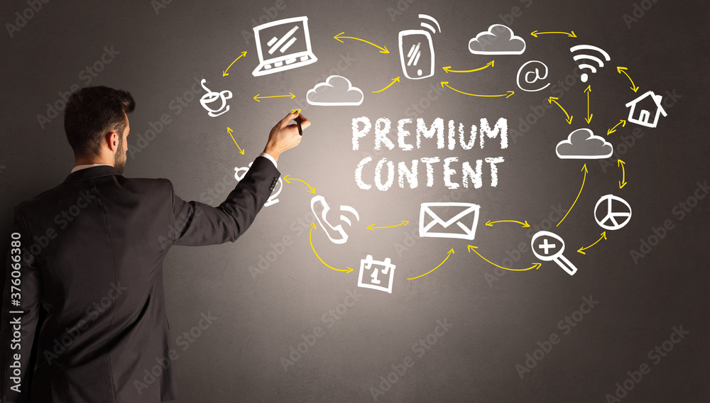 businessman drawing social media icons with PREMIUM CONTENT inscription, new media concept businessman drawing social media icons with PREMIUM CONTENT inscription, new media concept