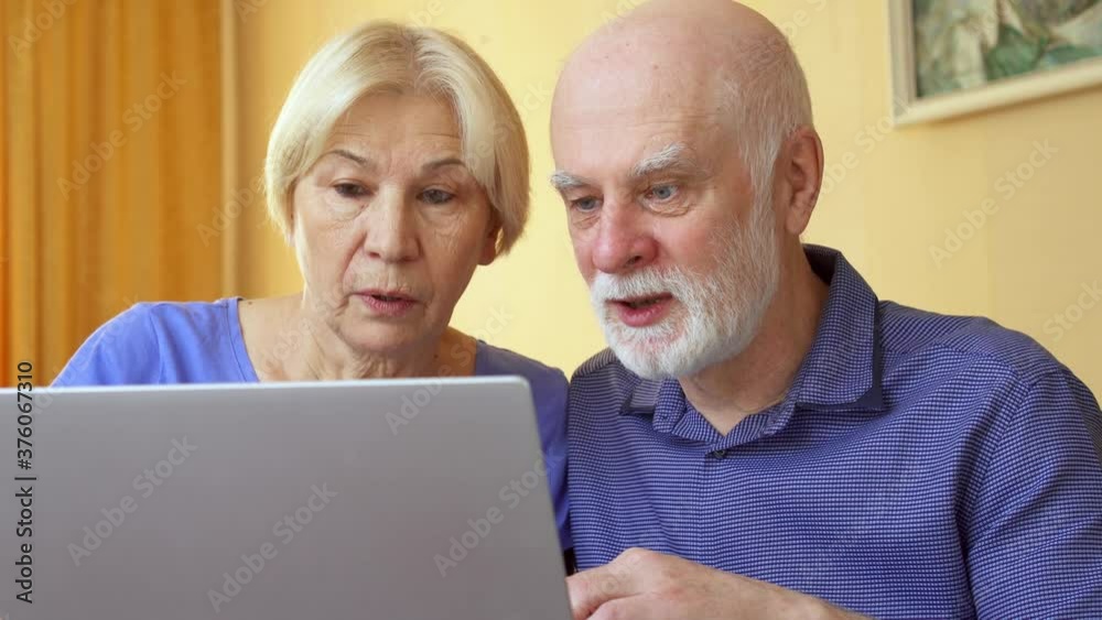 Senior couple work from home. Wealthy retired family receive good news about successful online investment and increase in savings value. Concept of wealth growth and financial success after retirement Senior couple work from home. Wealthy retired family receive good news about successful online investment and increase in savings value. Concept of wealth growth and financial success after retirement