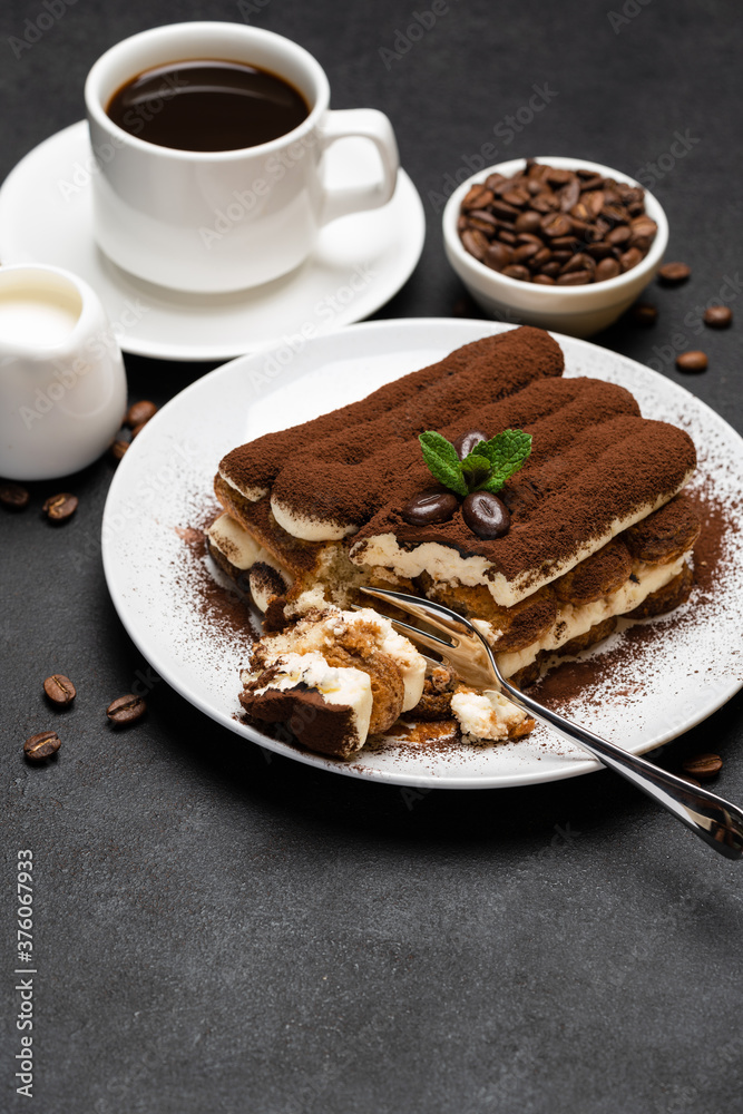 portion of Classic tiramisu dessert and cup of fresh espresso coffee on concrete background portion of Classic tiramisu dessert and cup of fresh espresso coffee on concrete background