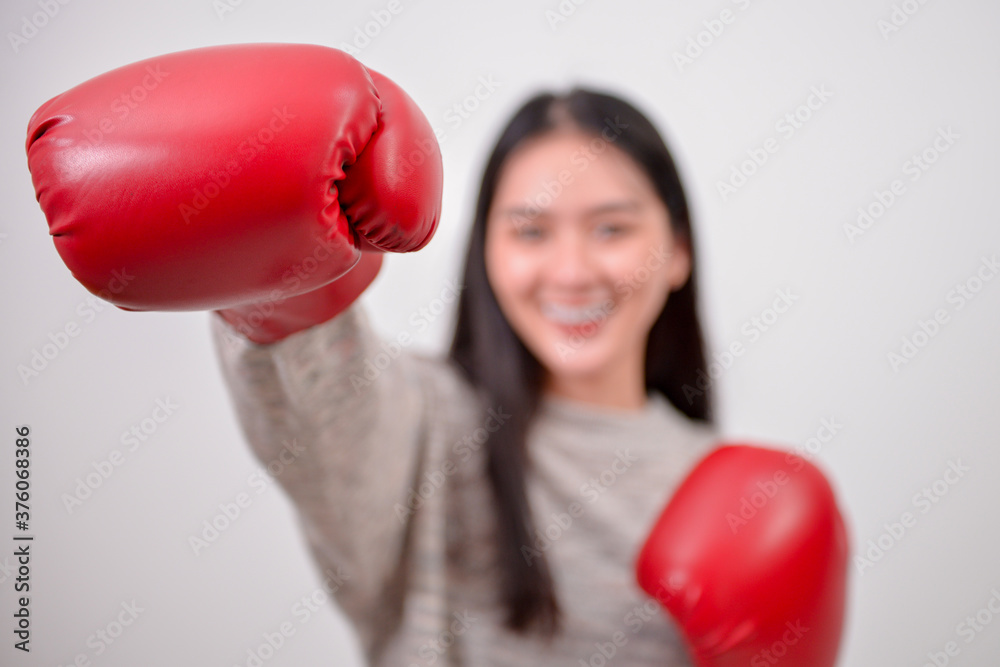business woman fighing for business with boxing gloves,abstract business concept. business woman fighing for business with boxing gloves,abstract business concept.