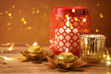Diwali holiday home decorations on wooden table.