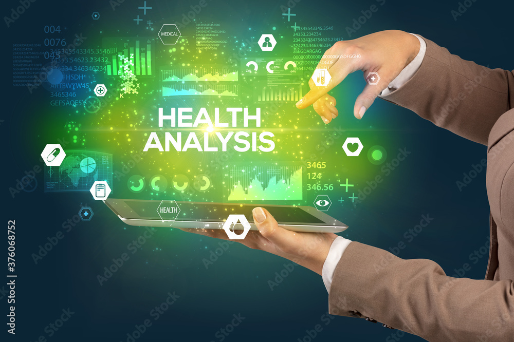 Close-up of a touchscreen with HEALTH ANALYSIS inscription, medical concept Close-up of a touchscreen with HEALTH ANALYSIS inscription, medical concept