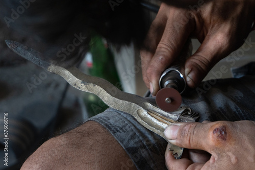 making traditional Balinese keris manually. The process of carving Balinese keris details are a little complicated and meticulous