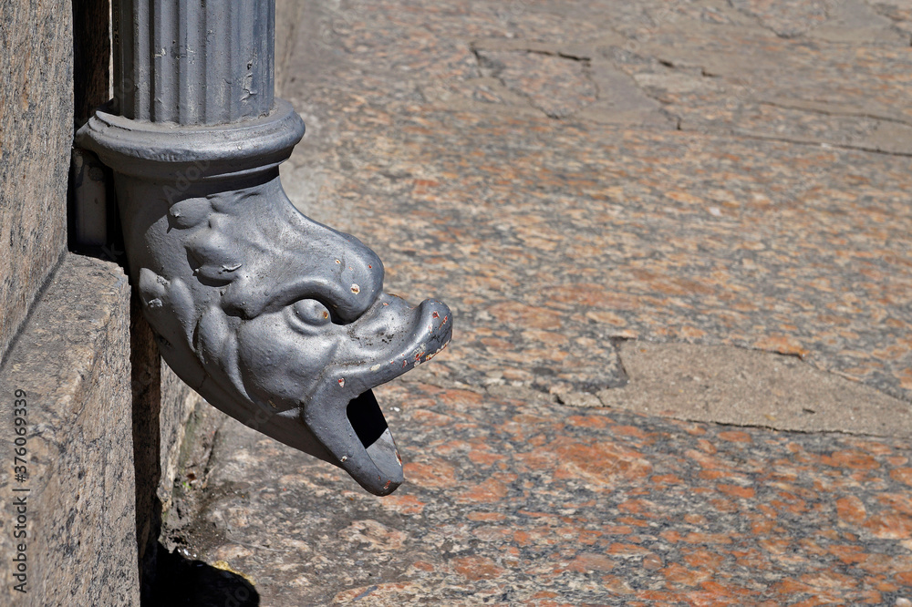 Metallic downspout in shape of beast head, Gargoyle drain, Downtown Rio