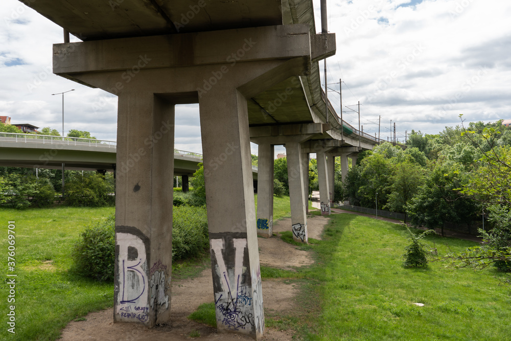 concrete pillars of a traffic bridge in the city center
concrete pillars of a traffic bridge in the city center