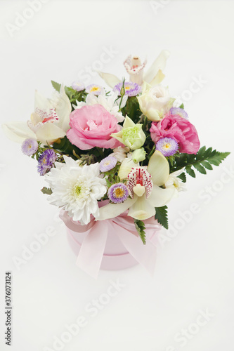 Romantic bouquet of delicate flowers in pink paper gift box © Liudmyla