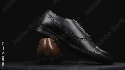 Rotation of a pair of classic men's shoes with laces. Three hundred and sixty degrees full revolution.