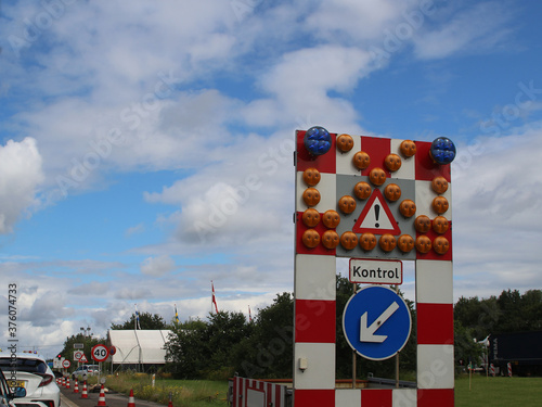 Road sign at the Danish-German border regulating the traffic for entry checks (A7 near Flensburg) photo