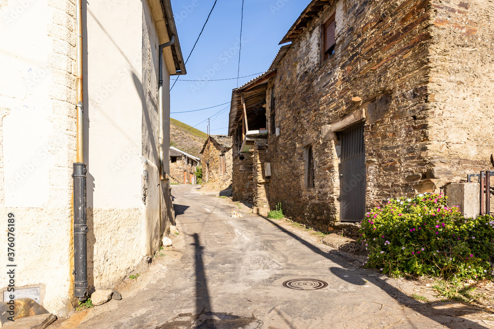 a street with typical old houses in Rihonor de Castilla village, municipality of Pedralba de la Praderia, Zamora province, Spain