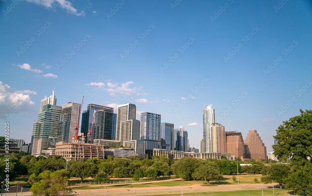 Wide Angle View of Austin Texas Skyline With Mostly Clear Skies in a summer Evening Wide Angle View of Austin Texas Skyline With Mostly Clear Skies in a summer Evening