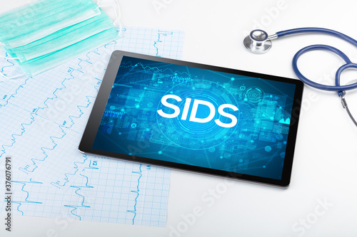 Close-up view of a tablet pc with SIDS abbreviation, medical concept