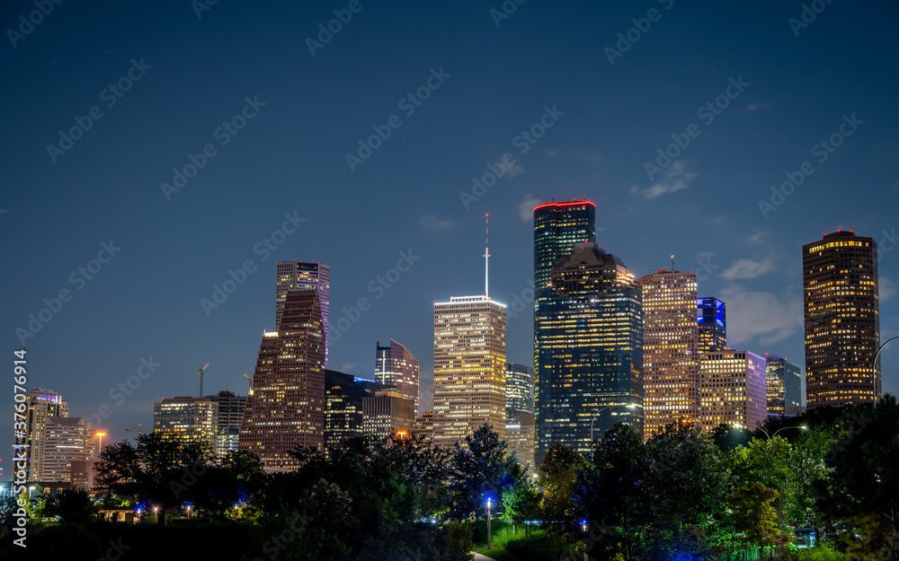 View of the Houston Office Buildings and Contruction Cranes at Night