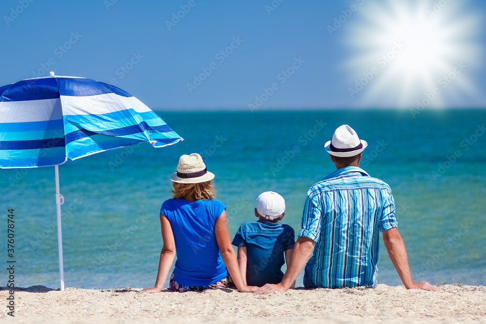 A Happy family parents with children by the sea on nature travel