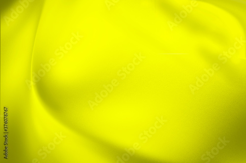 Abstract background. Colors: yellow, black. Gradual change of color from dark to light.