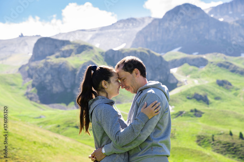 Romantic Family Couple In Mountains In Austria