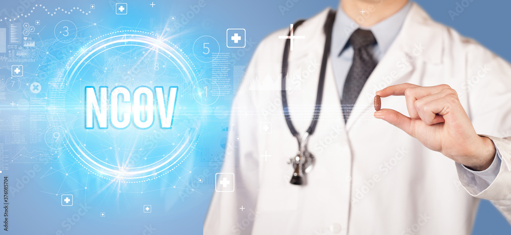 Close-up of a doctor giving you a pill with nCOV abbreviation, virology concept Close-up of a doctor giving you a pill with nCOV abbreviation, virology concept