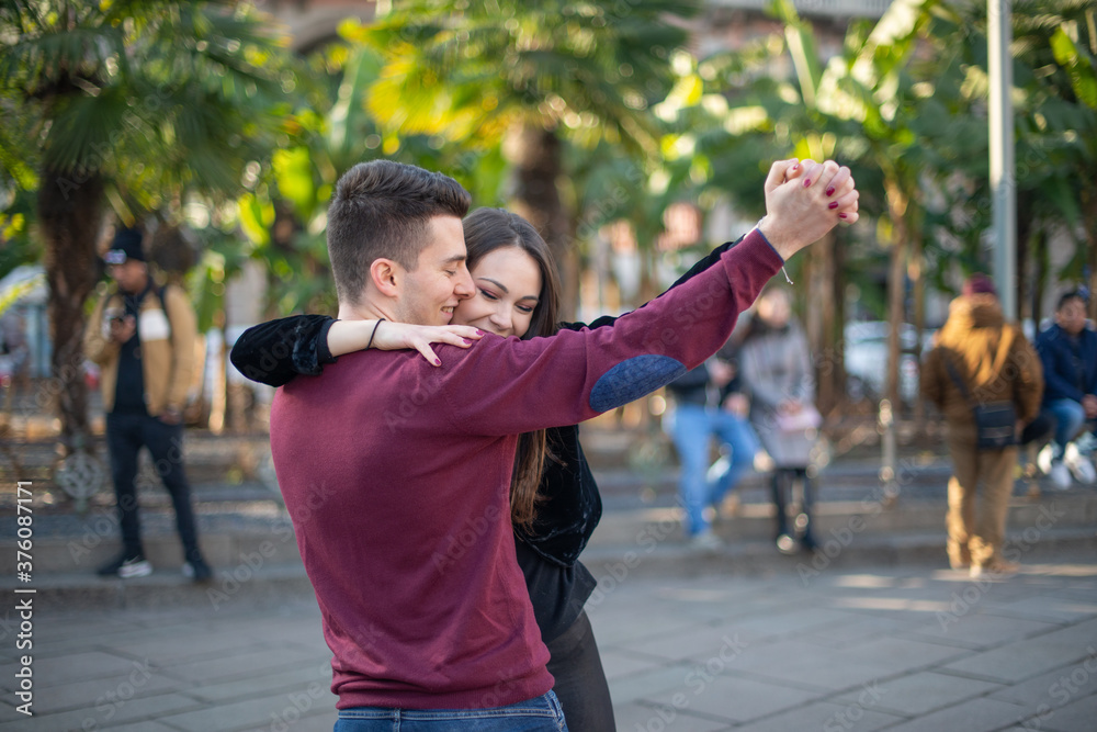 Young couple having fun and dancing outdoors Young couple having fun and dancing outdoors