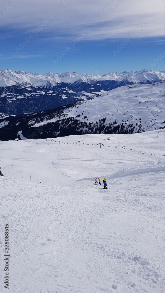 Skiing in the beautiful mountains of the Laax ski resort in Flims, Switzerland