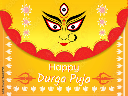 Happy Durga Puja vector illustration background with goddess Durga eyes and trishul.