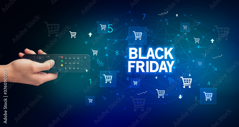 hand holding wireless peripheral with BLACK FRIDAY inscription, online shopping concept hand holding wireless peripheral with BLACK FRIDAY inscription, online shopping concept