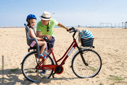 Father And Daughter With Bicycle
