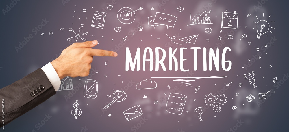 Close-Up of cropped hand pointing at MARKETING inscription, modern business solution concept Close-Up of cropped hand pointing at MARKETING inscription, modern business solution concept