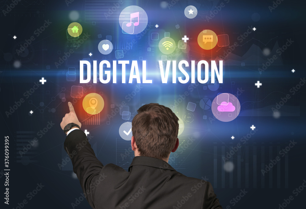Rear view of a businessman with DIGITAL VISION inscription, modern technology concept Rear view of a businessman with DIGITAL VISION inscription, modern technology concept