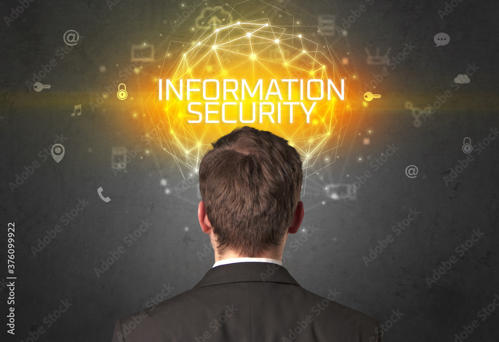Rear view of a businessman with INFORMATION SECURITY inscription, online security concept Rear view of a businessman with INFORMATION SECURITY inscription, online security concept