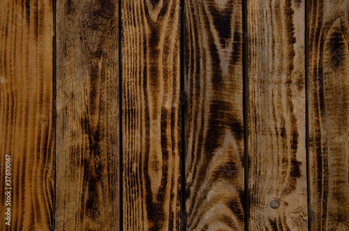 The texture of burnt wood. Pine wood background.