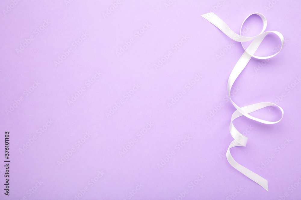 Purple ribbon on purple pastel background, design element.