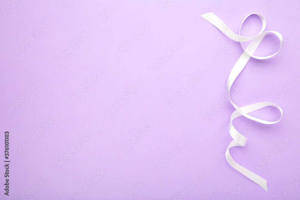 Purple ribbon on purple pastel background, design element. Purple ribbon on purple pastel background, design element.