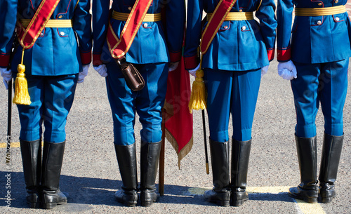 military parade in a city, soldiers in full dress uniforms ordered in parade formation