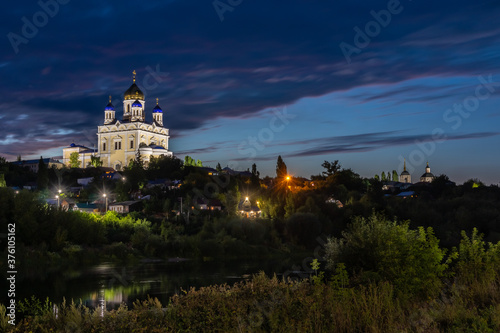Russia, the city of Yelets, view of the high Bank of the Sosna river and the Cathedral of the ascension of the Lord at dusk.