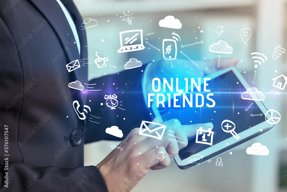 Close-up Of A Person Using Social Networking with ONLINE FRIENDS inscription Close-up Of A Person Using Social Networking with ONLINE FRIENDS inscription