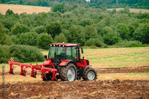 farmer on a tractor plowing the land