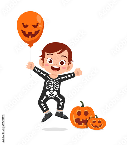 happy cute little kid boy and girl celebrate halloween wears skeleton costume