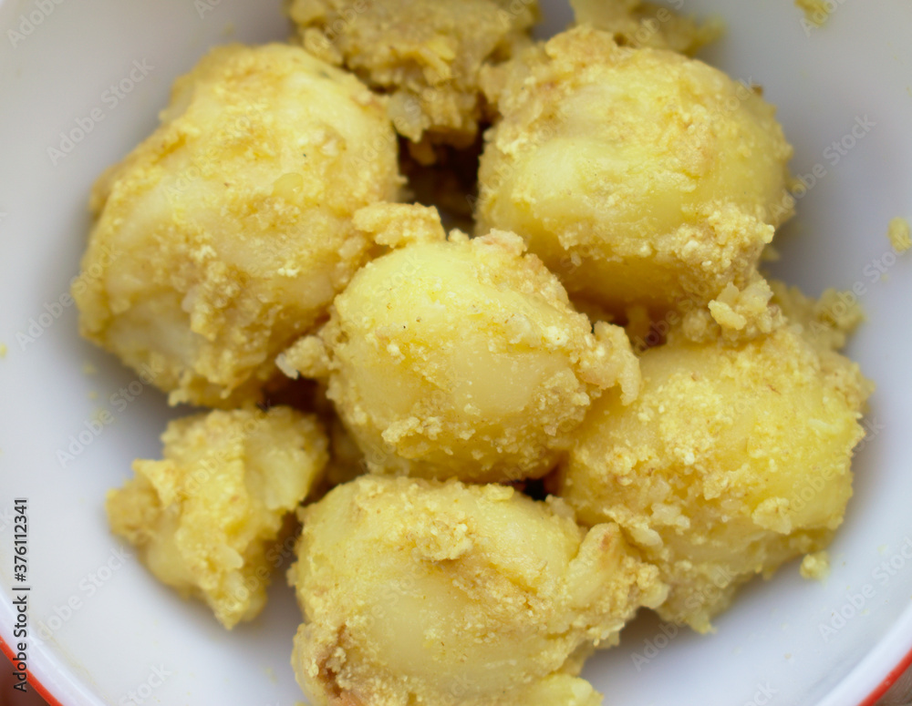 Top view of Boiled Potatoes with butter and sour curd Food Photography