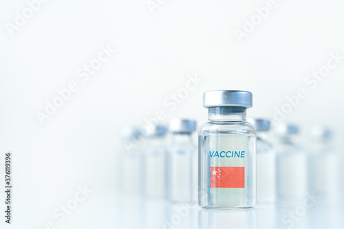 Transparent vials with China flag. Vaccine for covid-19 coronavirus, flu, infectious diseases. Injection after clinical trials for vaccination of human, child, adult, senior. Medicine, drug concept