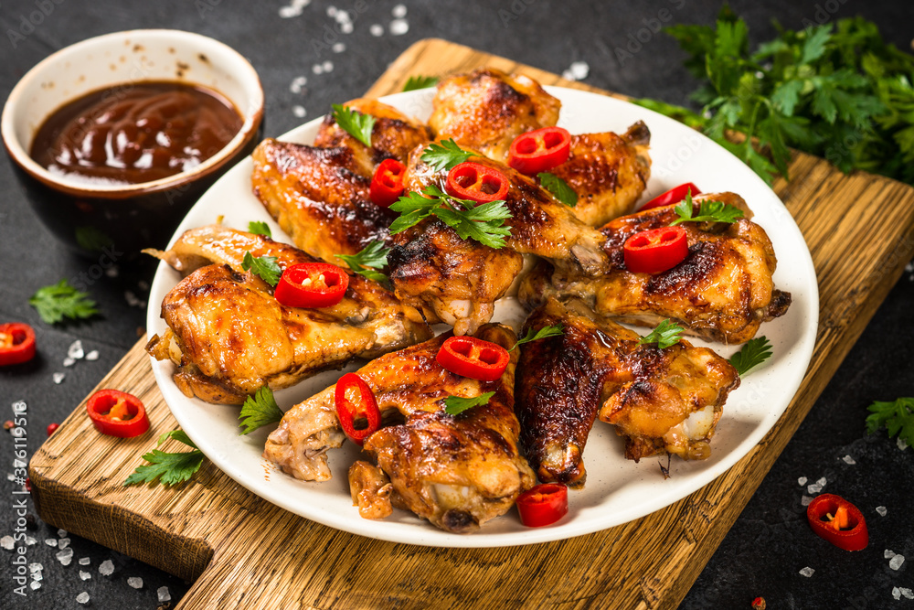 Grilled chicken wings with barbecue sauce. Grilled chicken wings with barbecue sauce.