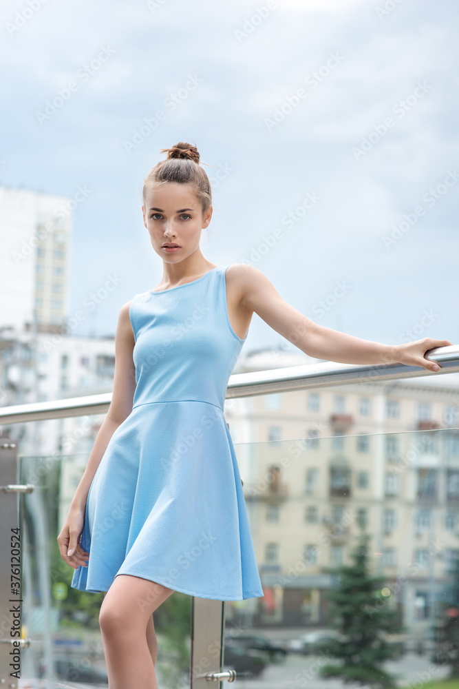 Beautiful fashion yaong woman posing in the city.